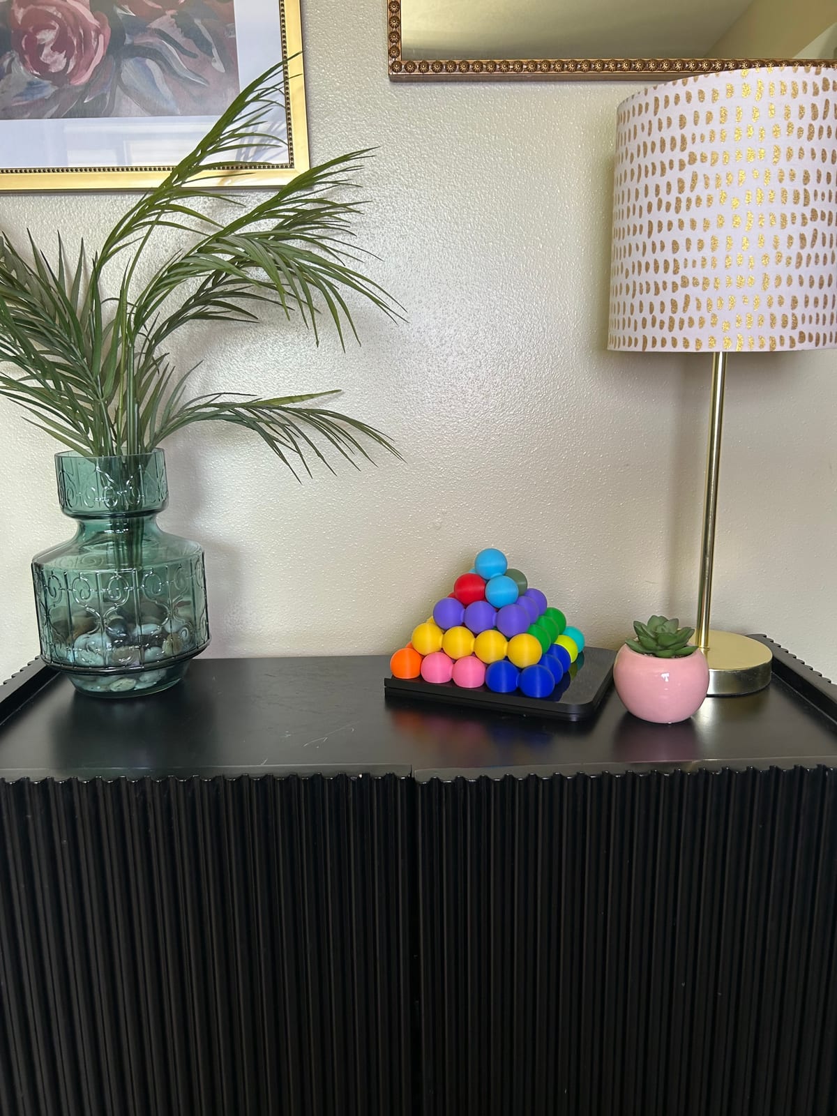 Katachi-Go built into a 3D pyramid, displayed on a shelf next to a lamp and framed art